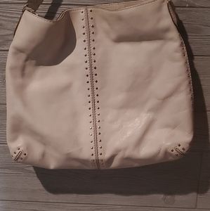 Michael Korrs large cream colored leather bag